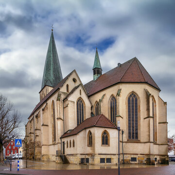 Gothic apse of St. Remigius church stands in Borken, Germany. Winter daylight under a cloudy grey sky