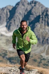 Fototapeta premium Male athlete trail running on mountain path