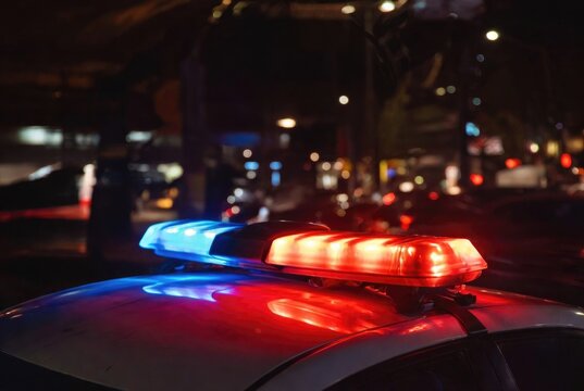 Blurred background of police flashing lights at the crime scene 