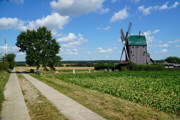 A post mill in Saxony-Anhalt. Built in 1848, the wooden mill was used to grind grain until 1952. Eimersleben, Börde District, Saxony-Anhalt, Germany. © juerginho