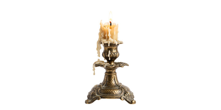 A single burning wax candle in an ornate vintage brass candlestick 