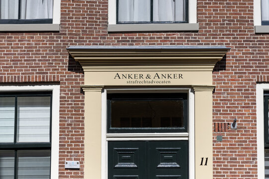 Leeuwarden, Netherlands - August 8, 2026: Entrance of Anker & Anker strafrechtadvocaten in Leeuwarden, showing the law office sign above a dark green door on a historic brick building facade.