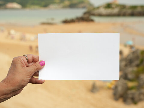 Woman Holding Blank Sign Outdoors with Copy Space