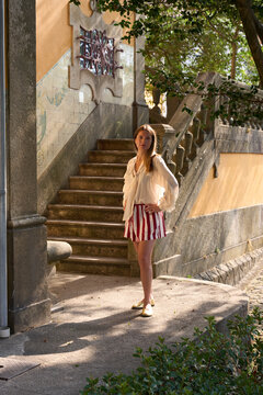 Woman Posing at Stairs in a Park on a Sunny Day