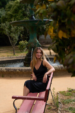 Woman Relaxing on a Bench in a Park in  Porto, Portugal
