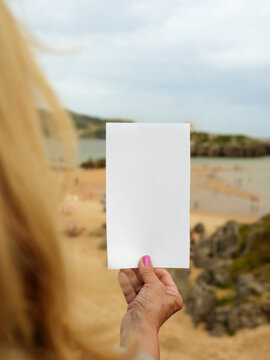 Blank Sign at Beach with Woman and Copy Space
