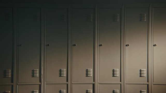 Orderly Rows of Closed Student Lockers Create Minimalist Backdrop in School Corridor. Versatile Education Content Representing Organization, Structure, Safety, Everyday Academic Life without People.