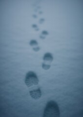 Obraz premium Footprints in fresh snow path.