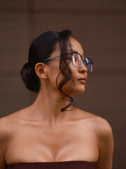 Asian Woman Profile Portrait Wearing Eyeglasses Outdoors © Stanislav