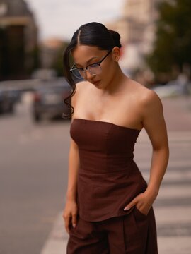 Asian Woman Standing Outdoor Street Wearing Brown Top