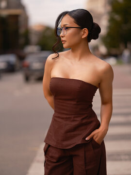 Asian Woman Standing Outdoor Street Wearing Brown Top
