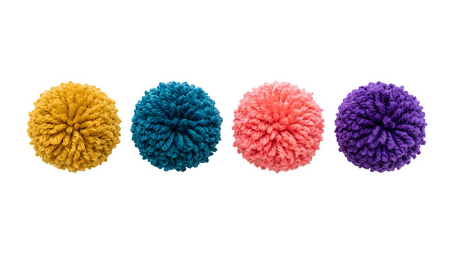 Colorful pom poms made of yarn in yellow blue coral and purple.