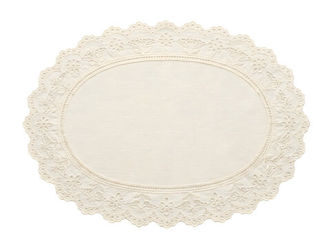 Elegant oval lace doily mat for vintage style table setting.