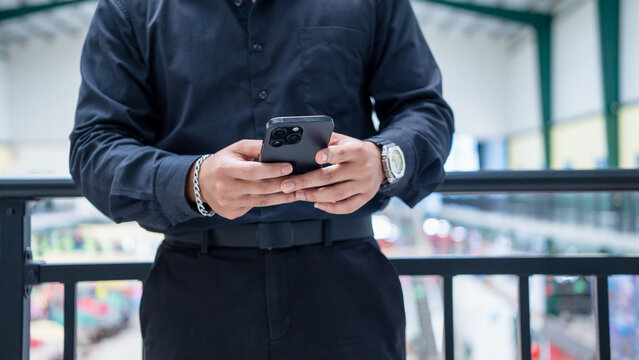 Close up businessman hand holding phone using AI chatbot to analysis finances, browsing internet, online shopping. People use smartphone artificial intelligence working management finance, marketing