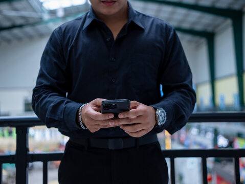 Close up businessman hand holding phone using AI chatbot to analysis finances, browsing internet, online shopping. People use smartphone artificial intelligence working management finance, marketing