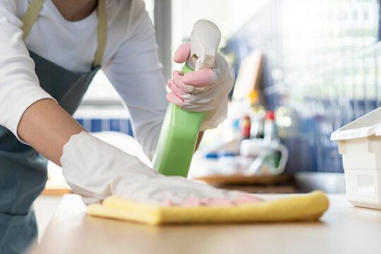 Close-up woman use small towel cleaning kitchen