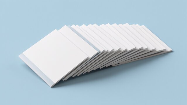 Stack of blank white rectangular brochures on a light blue background