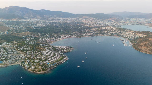 Aerial View of Bodrum Bay Coastline with Sailboats and Villas
