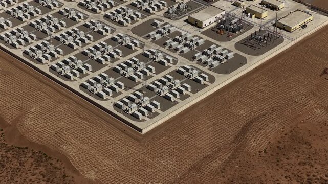 Aerial View of Utility-Scale Solar Farm with Battery Energy Storage System in Arid Desert