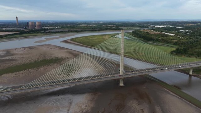 Aerial view of mersey gateway bridge traffic crossing river