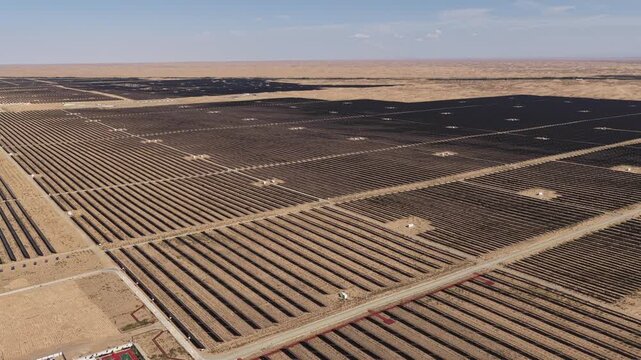Aerial View of Utility-Scale Solar Farm with Battery Energy Storage System in Arid Desert