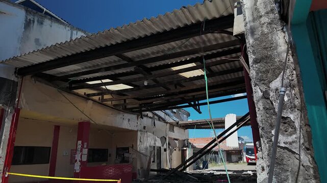 colombia earthquake damage to bus terminal building structure with collapsed roof in calima darien