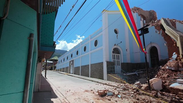 colombia earthquake damage with collapsed blue church facade and rubble