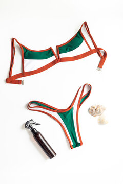 Minimal summer flat lay with women&rsquo;s bikini &mdash; clean aesthetic, beach vacation concept, top view on neutral background
