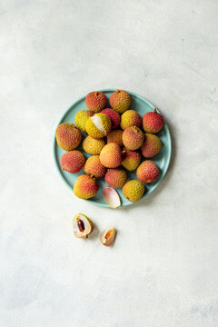 Plate of exotic lychee fruit, top view. Healthy vegetarian meal ready to eat