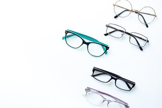 Glasses for vision on a white background in optical store. Vision test concept, stylish glasses concept