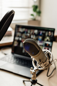 Home studio for podcast recording. Interior with microphone and laptop on table