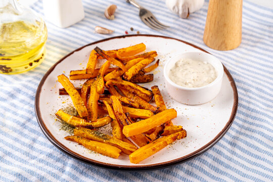 Tasty Air Fried Carrot or Pumpkin Fries. Homemade french fries made with Carrot or Pumpkin wedges, healthy vegan diet food idea