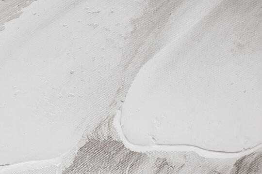 White acrylic paint stroke texture on canvas fabric close up detailed artistic background full frame art design element stock photo