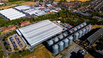 Aerial view of industrial grain silos and factory warehouses complex © Андрей Нелупов