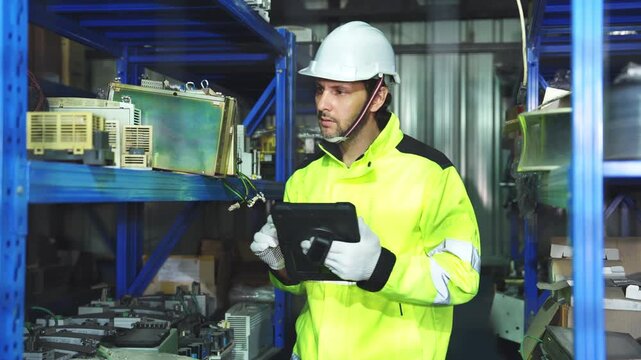 Industrial engineer inspecting a robotic arm machine in an automated manufacturing factory, robotics, automation, smart manufacturing, machine maintenance, quality control and Industry 4.0 technology.