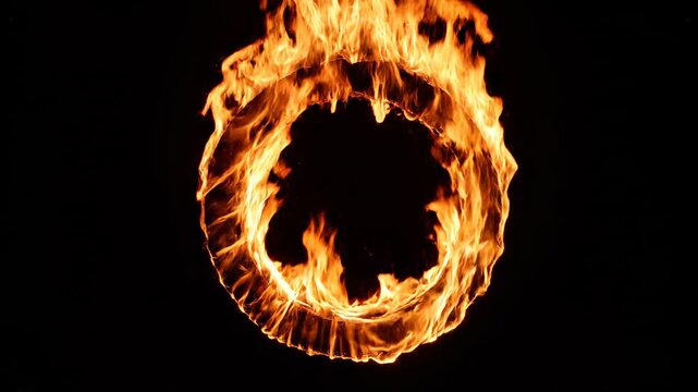 Fiery ring of flame burning intensely against a dark backdrop with cinematic motion