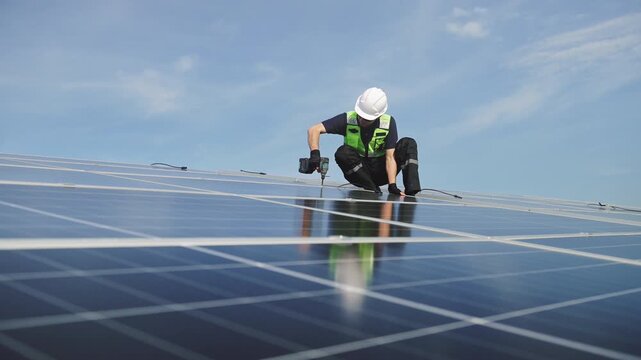 Technician installing rooftop solar panels for green energy, supporting renewable energy, clean power, sustainable technology and solar infrastructure.