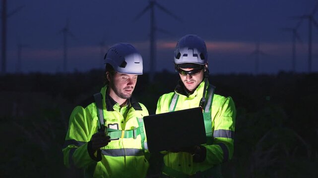 Engineers working on site in wind turbine farm, Wind turbines generate clean energy source, Eco technology for electric, industry environment, sustainable technology wind power maintenance.