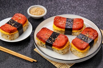 Classic Hawaiian spam musubi, made with grilled spam, seasoned rice, and wrapped with nori seaweed © Noor