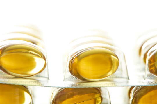 Yellow Softgel Capsules in Blister Pack Close-Up