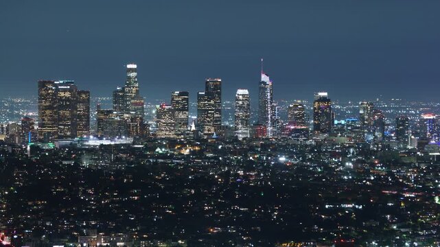 Los Angeles Downtown Night Skyline Telephoto from Griffith Park Time Lapse Pan R California USA