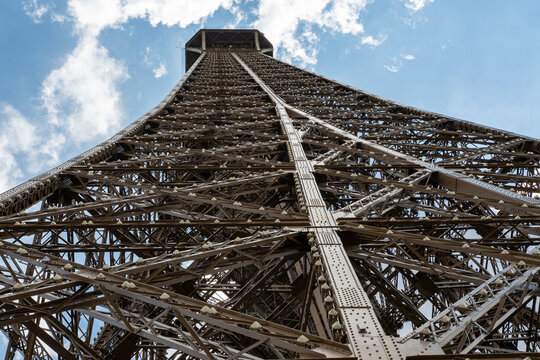 Eiffel tower, Paris. Unusual angle of the Eiffel tower, buttom to top view