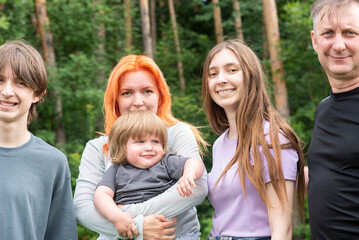 Fototapeta premium Happy big family with children in summer nature forest