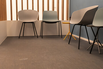 Obraz premium Chairs arranged in a waiting room with a simple design and modern style