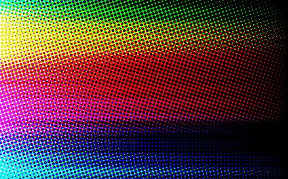 Explosive vibrant multi color halftone dot pattern creating an energetic abstract pop art style background