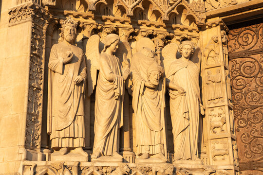 Notre Dame de Paris: The martyr Saint Denis, holding his head, over the Portal of the Virgin