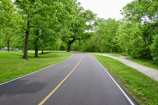 The empty country road on a cloudy spring day.
