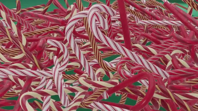 A 3D animation featuring a pile of red, white, and gold Christmas candy canes falling and stacking up against a green background.