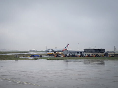 Paris, France - March 28, 2018 - American Airlines airplane on the ramp at Charles de Gaulle Airport Paris in rainy weather