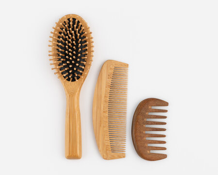 Eco friendly wooden hair brushes and combs set mockup on white background